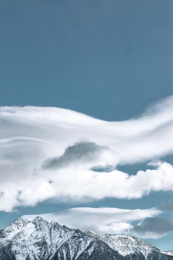 mountain under white clouds mountain under white clouds