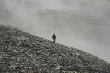 mountaineer climbing down on mountain mountaineer climbing down on mountain