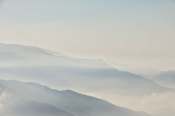 mountains during foggy season mountains during foggy season