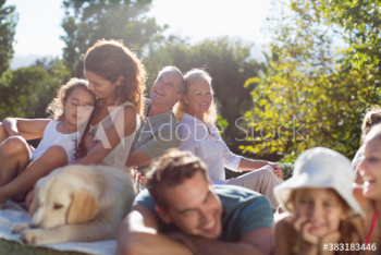 Multi-generation family, relaxing in sunny backyard Multi-generation family, relaxing in sunny backyard