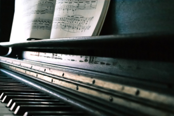 Music Sheet on Black Piano Music Sheet on Black Piano