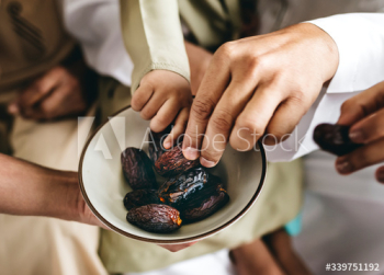 Muslim family eating dates Muslim family eating dates