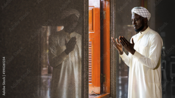 muslim man having worship and praying for allah blessing in islam ceremony in mosque during islamic ramadan period