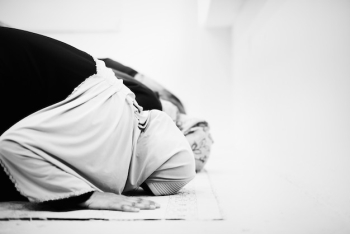 Muslim people bowing down and praying Muslim people bowing down and praying