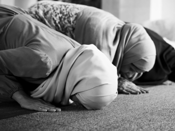 Muslim people praying in Sujud posture Muslim people praying in Sujud posture