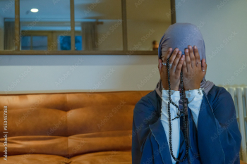 Muslim woman praying at home Muslim woman praying at home