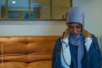 Muslim woman praying at home Muslim woman praying at home