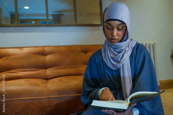 Muslim woman praying at home Muslim woman praying at home