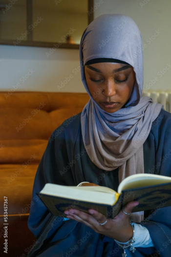 Muslim woman praying at home Muslim woman praying at home