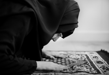 Muslim woman praying in Sujud posture Muslim woman praying in Sujud posture