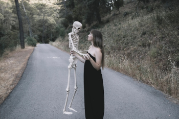 Mysterious lady holding bones
