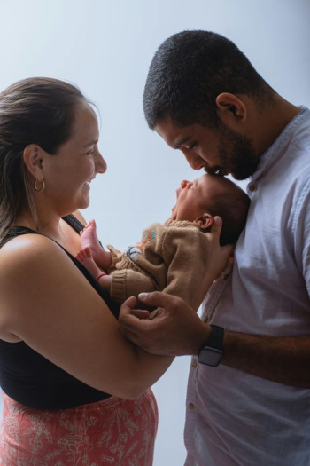 New Parents Adoring Their Newborn