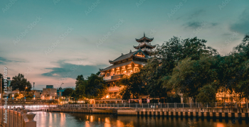 Night scene of Phap Hoa pagoda along Nhieu Loc canal (Saigon river) at night in Ho Chi Minh City, Vietnam