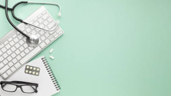 Notepad; wireless keyboard with stethoscope and medicines over surface Free Photo