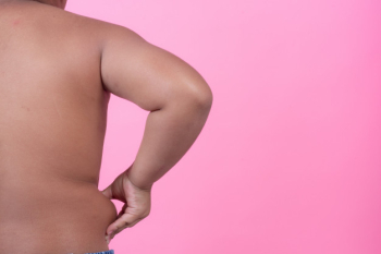 Obese boy who is overweight on a pink background. Free Photo Obese boy who is overweight on a pink background. Free Photo