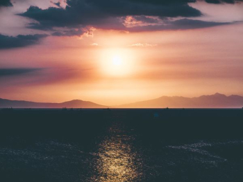 ocean and island during sunset ocean and island during sunset