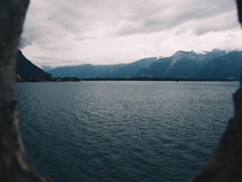 Ocean Near Mountain Under Cloudy Sky Ocean Near Mountain Under Cloudy Sky