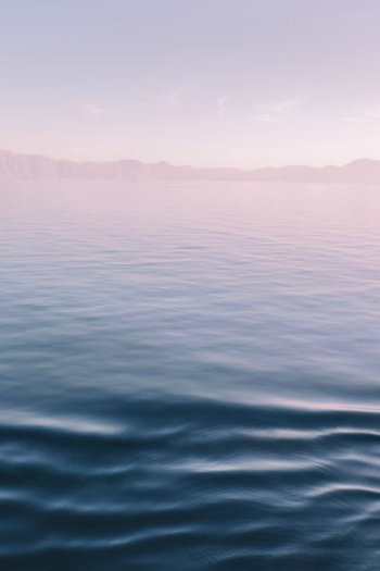 ocean under gray sky during daytime