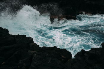 ocean wave near rock ocean wave near rock
