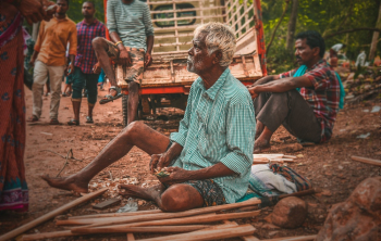 Old Man Sitting on Ground Old Man Sitting on Ground