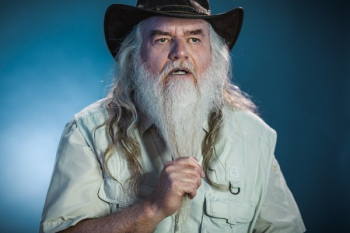 Old Man Stroking Beard And Thinking