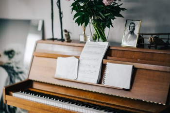 Old piano with sheet music Old piano with sheet music