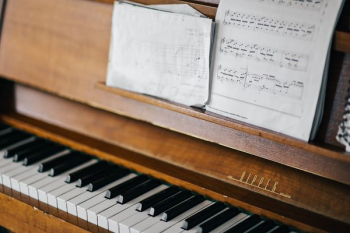 Old piano with sheet music Old piano with sheet music