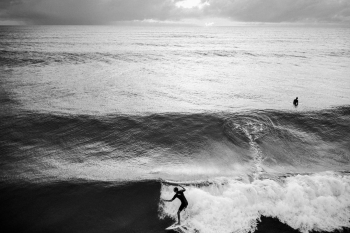 One guy surfing, one not One guy surfing, one not