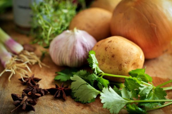 onions and potato on table onions and potato on table