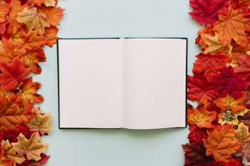 Open book in autumn leaves frame Open book in autumn leaves frame
