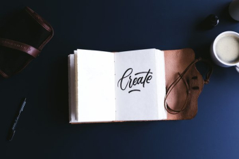 Open Notebook And Coffee Cup