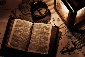 Opened Bible on Wooden Surfaca Opened Bible on Wooden Surfaca