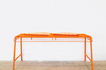 orange steel scaffolding on brown surface orange steel scaffolding on brown surface