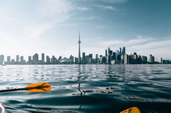 Paddling By City Skyline Paddling By City Skyline