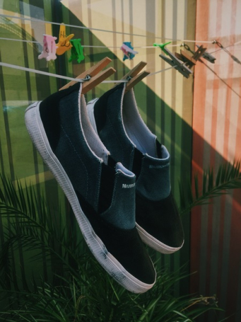 Pair of Shoes Hanged on Clothes Line Pair of Shoes Hanged on Clothes Line