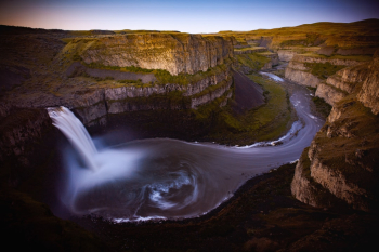 Palouse Falls Dawn. Palouse Falls is located in an area of southeastern Washington where the scenery is much different than what you would typically associate with the PNW. It's a beautiful area of rolling hills and fields of grass. In the middle of it all is this waterfall, with one of the coolest little campgrounds just off the side.