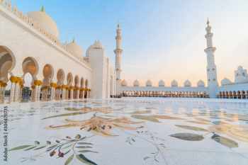 Panoramic view of Sheikh Zayed Grand Mosque, Abu Dhabi, United Arab Emirates. The third biggest mosque in the world. Blue sky sunny day.