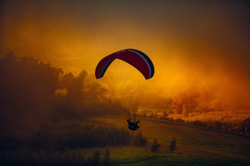 paragliding during sunset paragliding during sunset
