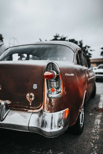 parked classic orange car parked classic orange car