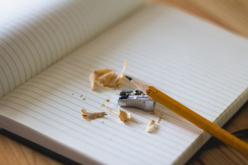 pencil and sharpener on notebook page pencil and sharpener on notebook page