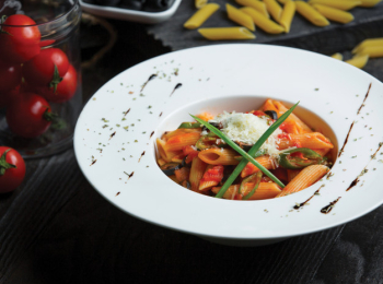 Penne pasta in tomato sauce served with herbs and parmesan Free Photo Penne pasta in tomato sauce served with herbs and parmesan Free Photo