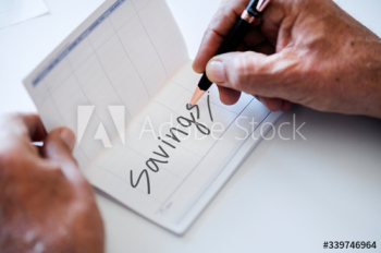 People checking bankbook isolated on white table People checking bankbook isolated on white table