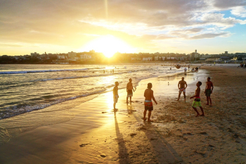 People on Beach during Sunset