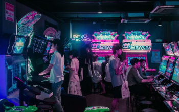 people playing arcade games people playing arcade games