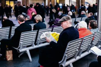 people reading on grey gang chairs people reading on grey gang chairs