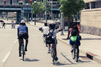 People Riding Bicycles on Road People Riding Bicycles on Road