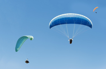 People Riding Para Gliders People Riding Para Gliders