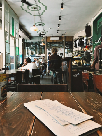 People Sitting on Bar Chairs and Dining Chairs People Sitting on Bar Chairs and Dining Chairs