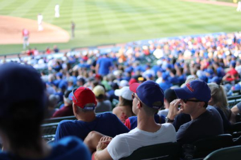 people sitting on stadium watching sports people sitting on stadium watching sports