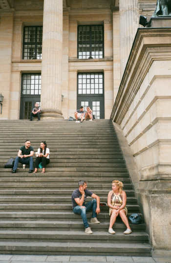 People Sitting on Stairs People Sitting on Stairs